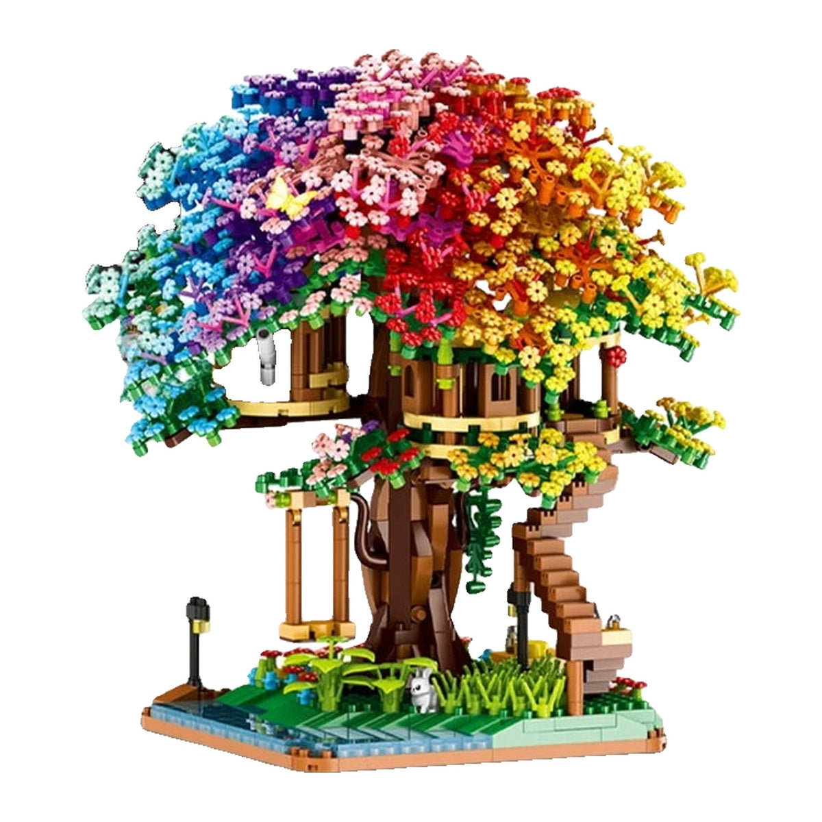 Arbre LEGO entier dont le feuillage en dôme passe du bleu au jaune par bandes, avec sa cabane perchée et son ruisseau