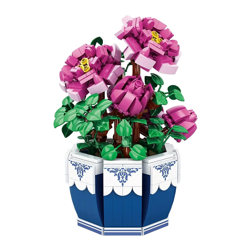 Pivoine LEGO d'un fuchsia franc sans demi-teinte, fleurs clipsées sur des branches en briques, pot compris