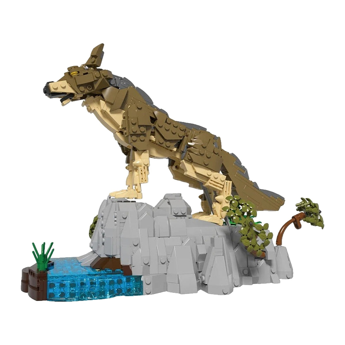 LEGO Loup en plein élan au-dessus de son rocher, avec le point d'eau translucide et les herbes fournis
