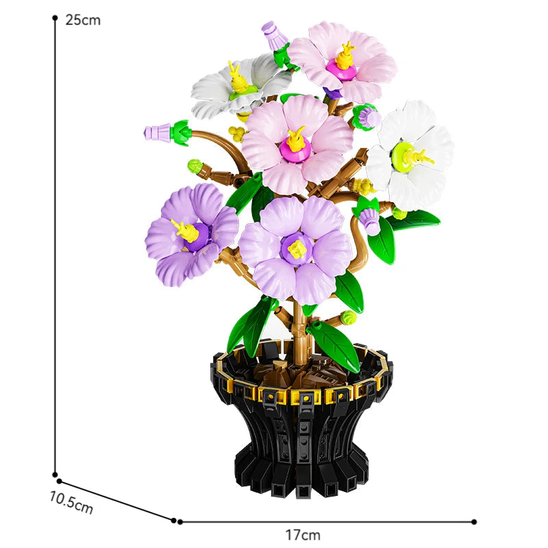 Le vase noir à cannelures dorées fourni, qu'on tourne du côté d'où l'on souhaite regarder les fleurs