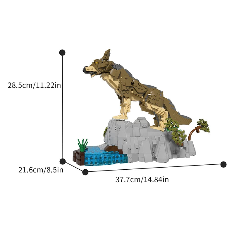 Le rocher du loup, ses touffes d'herbe et le point d'eau monté en briques translucides