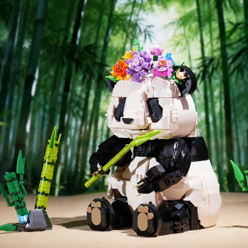 Panda noir et blanc en position assise, monté en briques compatibles, prêt à poser sur une étagère