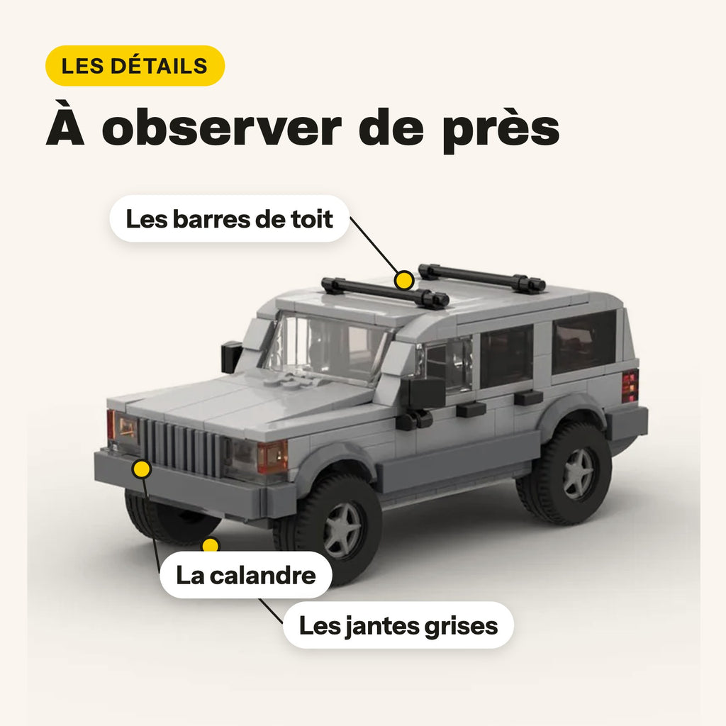 Barres de toit, calandre et jantes grises de la Jeep Cherokee en briques de construction